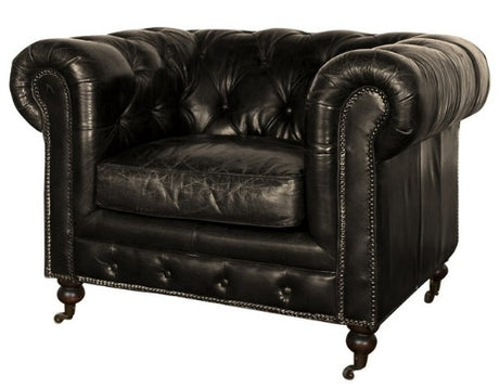 Luxurious Belon Black leather armchair in classic Chesterfield style, featuring brass nail details and multi-layer cushioning for comfort.