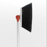 Adjustable Any-Angle Broom by OXO Good Grips features flexible bristles for efficient cleaning in hard-to-reach places.