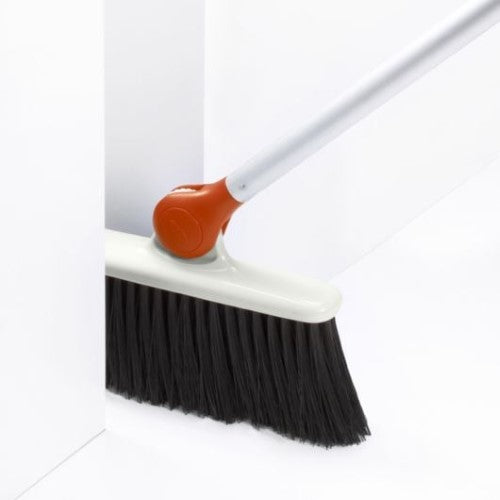 Any-Angle Broom featuring an adjustable head for easy cleaning in tight spaces, with flexible bristles to minimize dust scattering.