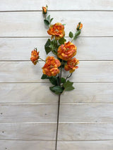 Vibrant orange artificial Camellia flower spray with 5 flowers and 2 buds, perfect for enhancing any decor.
