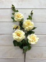 Soft yellow Camilia artificial flower spray featuring 5 flowers and 2 buds, ideal for elegant, low-maintenance home decor.