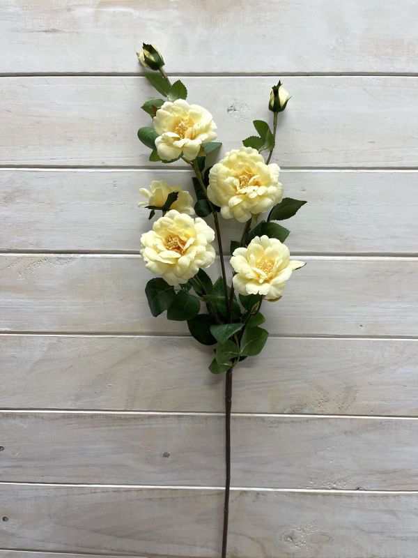 Artificial flower spray featuring 5 soft yellow blooms and 2 buds, ideal for maintenance-free home decor.