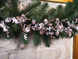 Elegant 1.8m Cone Garland with faux snow, perfect for festive decor and enhancing holiday charm indoors or outdoors.