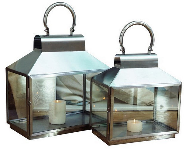 Large brushed stainless steel lantern with glass, featuring clean lines for showcasing candles in contemporary decor.