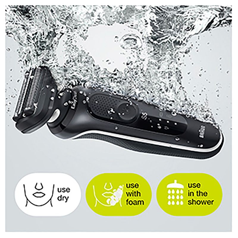 Braun Wet & Dry shaver with charging stand, two attachments, and three flexible blades for convenient grooming.