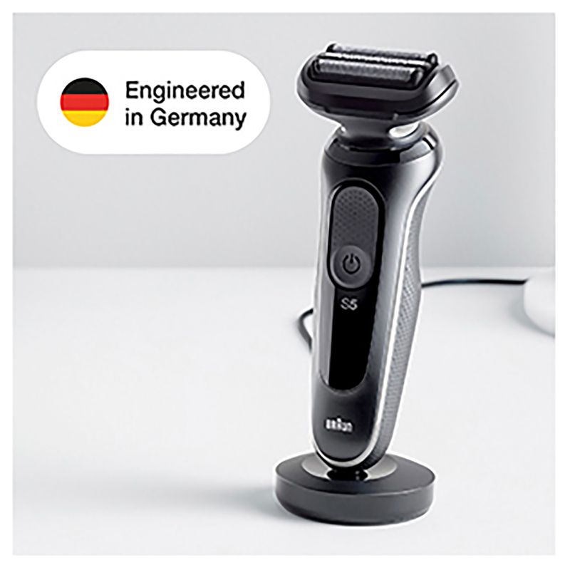 Braun Wet & Dry shaver with charging stand, 2 attachments, 3 flexible blades, AutoSense tech, waterproof design for versatile grooming.