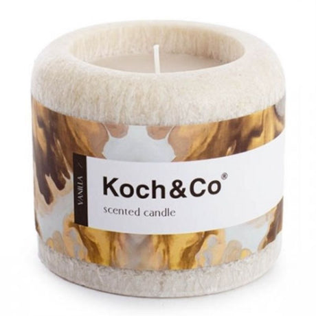 Beige pillar candle with rich vanilla scent, 10.3cm tall, perfect for creating a warm ambiance in any space.