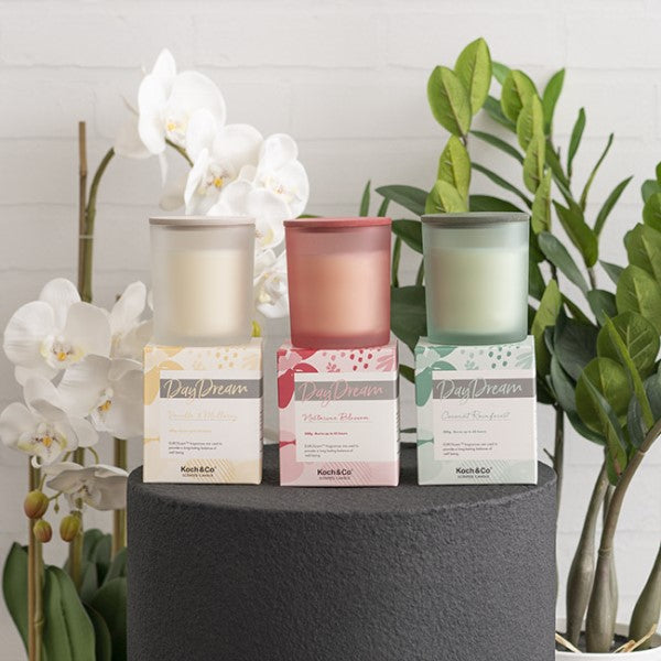 Scented candle in stylish container, featuring creamy vanilla and sweet mulberry, perfect for relaxation and ambiance.