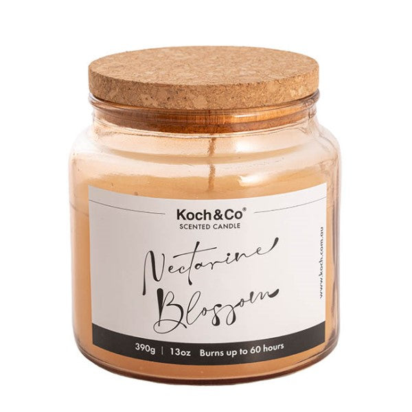 Scented candle in Nordic jar, infused with nectarines, providing 60 hours of delightful citrus aroma for relaxation.
