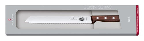 Victorinox 21cm bread knife with a serrated stainless steel blade and ergonomic wooden handle for effortless slicing.