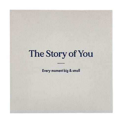Elegant small photo album with a natural cloth cover, showcasing "The Story of You" in embossed black foil, perfect for cherished memories.