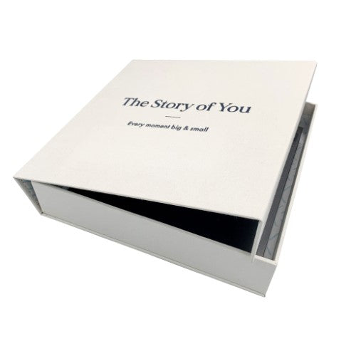 Elegant small photo album with black pages, handcrafted cover, and "The Story of You" embossed, ideal for preserving memories.