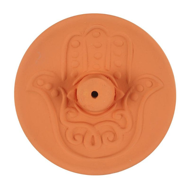 Hamsa Terracotta Incense Plate featuring intricate Hamsa design, perfect for adding peace and decor to your spiritual space.