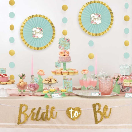 Mint To Be Buffet Table Decorating Kit featuring tent cards, picks, hanging decorations, and a glitter banner for festive events.