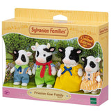 Limited edition Sylvanian Families Fresian Cow Family set featuring four movable figures: father, mother, boy, and girl cows.