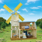 Sylvanian Families Celebration Windmill set featuring a light blue windmill, Polar Bear figures, and 36 accessories for imaginative play.