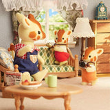 Alt text: "Sylvanian Families Highbranch Giraffe Family featuring dad Egbert, mom Olive, and kids Bran and Brie in playful poses."