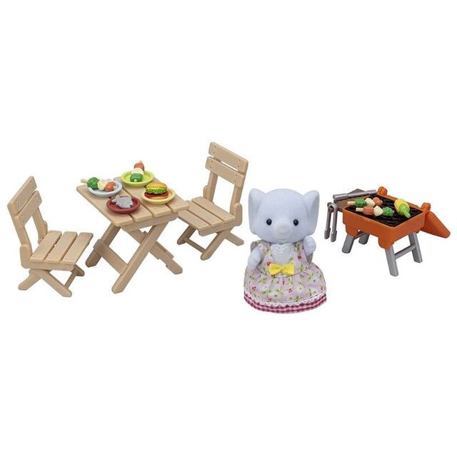 Sylvanian Families BBQ Picnic Set with Elephant Girl Miriam, featuring a grill, table, chairs, and colorful food accessories.