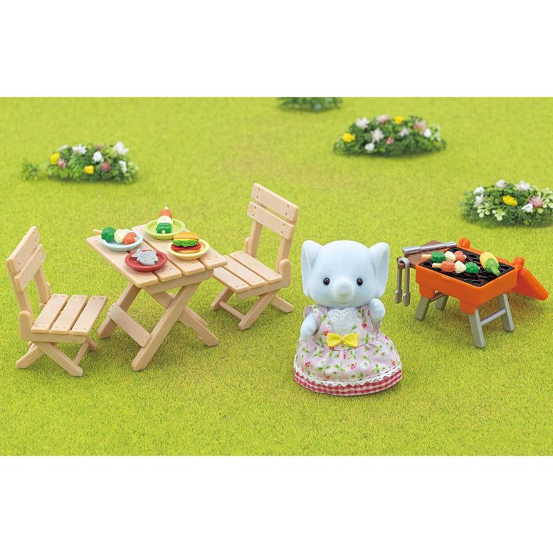 Sylvanian Families BBQ Picnic Set featuring Elephant Girl Miriam, complete with grill, accessories, and colorful plates for imaginative play.