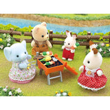 Sylvanian Families BBQ Picnic Set featuring Elephant Girl Miriam, complete with grill, table, chairs, and colorful food accessories.