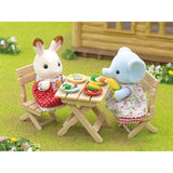 Sylvanian Families BBQ Picnic Set featuring Elephant Girl Miriam with a grill, table, chairs, and colorful food accessories.