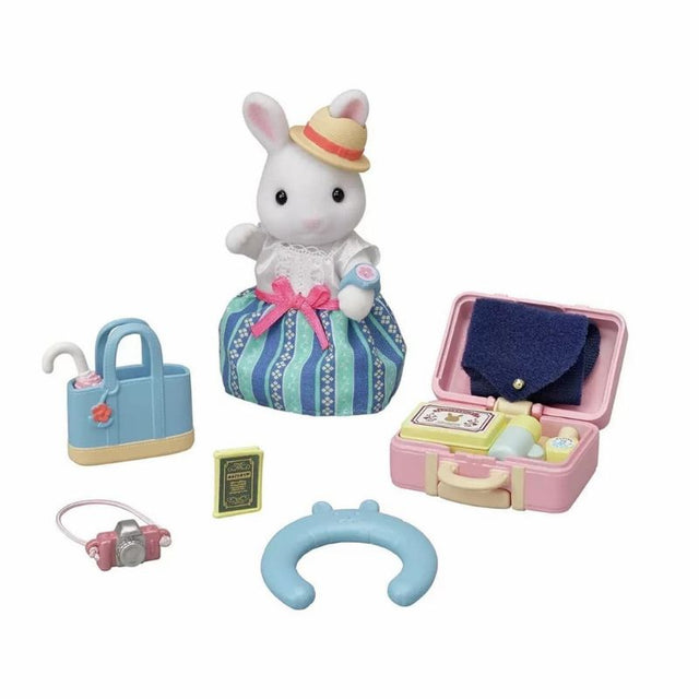 Sylvanian Families Weekend Travel Set featuring Emilia Snow Rabbit with suitcase, handbag, and travel accessories for imaginative play.