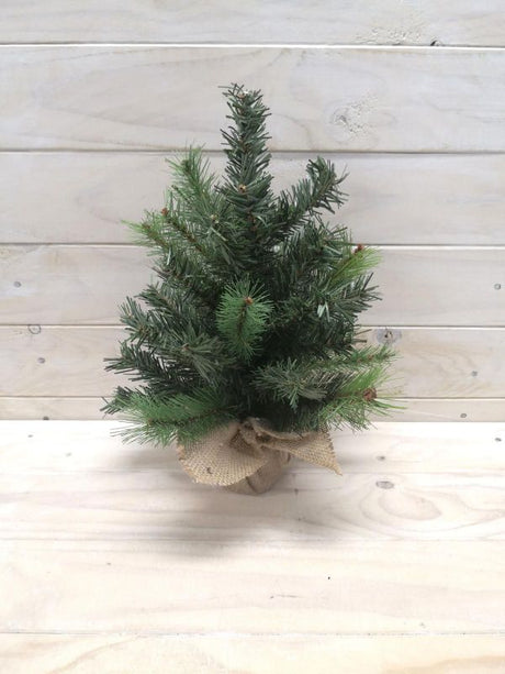 Artificial 12" green pine tree in burlap base, enhances home decor with a touch of nature and rustic charm.