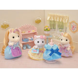 Sylvanian Families Princess Dress Up Set featuring Lyra, with yellow and blue dresses, tiara, and sparkling accessories for creative play.