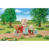 Sylvanian Families Popcorn Delivery Trike with Mother Barbara, popcorn maker, and assorted snacks for imaginative play.