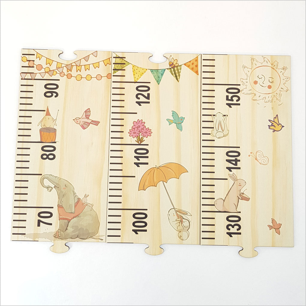 Woodland-themed growth chart ruler in eco-friendly pine veneer, featuring interactive puzzle pieces for unique home decor.