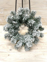 30cm Snow Pine Wreath featuring realistic snow accents, perfect for festive indoor or outdoor holiday decor.