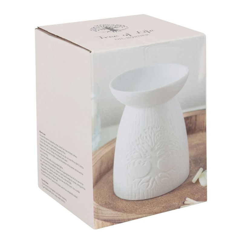 White ceramic oil burner with Tree of Life design, perfect for soothing fragrances and home decor.