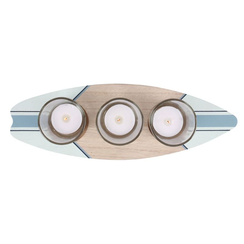 Surfboard-shaped tealight holder designed for three candles, perfect for coastal decor and beach-themed homes.