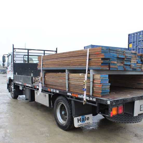 Heavy-duty 50mm x 6m truck tiedown with 5000kg break strength, UV and water resistant, featuring a rubber-handled ratchet.