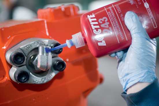 LOCTITE 243 medium strength threadlocker in blue liquid, ideal for securing bolts and preventing loosening from vibrations.