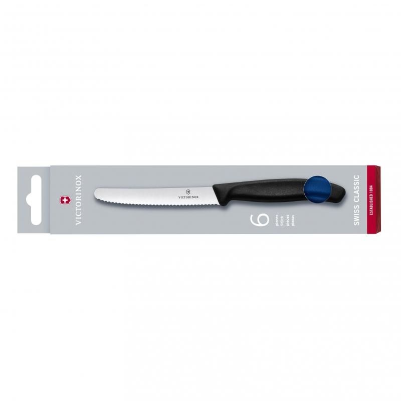 Set of six blue Victorinox wavy edge knives with high carbon stainless steel blades for precise cutting of steak and tomatoes.