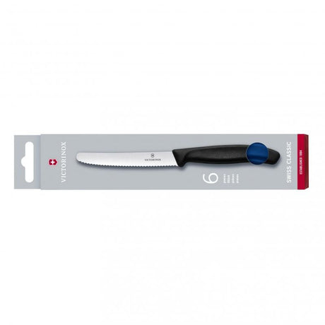 Set of six blue Victorinox wavy edge knives with high carbon stainless steel blades for precise cutting of steak and tomatoes.