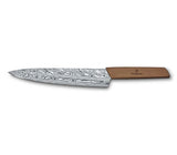 Victorinox Swiss Modern Damast Ltd Edition Carving Knife with Damasteel blade and walnut handle, showcasing artistry and elegance.