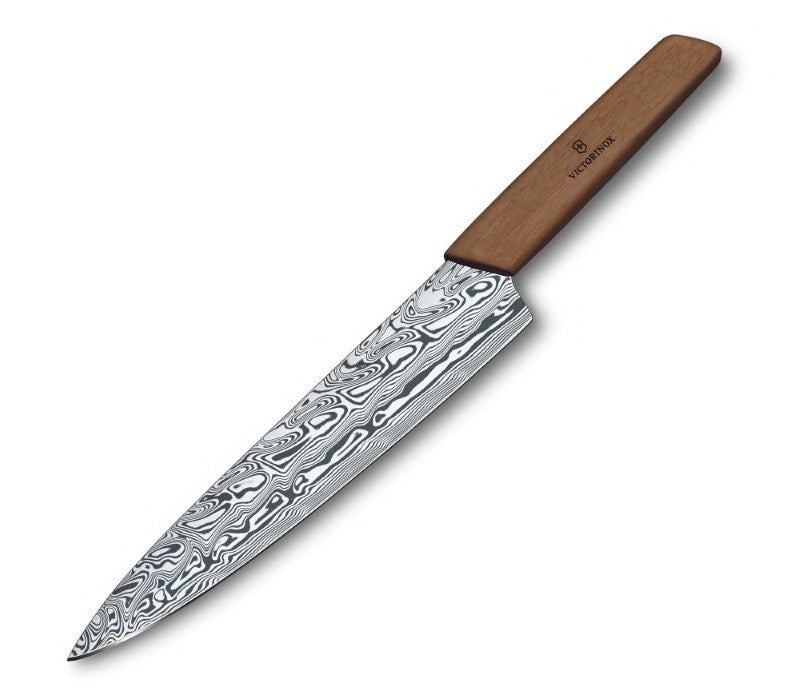 Victorinox Swiss Modern Damast Limited Edition Carving Knife featuring a unique Damasteel blade and ergonomic walnut handle.