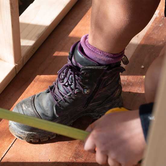 Women's Blundstone #897 safety boot in Black/Purple, featuring water-resistant leather, steel toe, slip-resistant outsole, and XRD® protection.