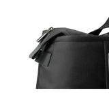 Sleek black Victorinox Weekender Duffle Bag with expandable capacity, ideal for travel, gym, or business trips.