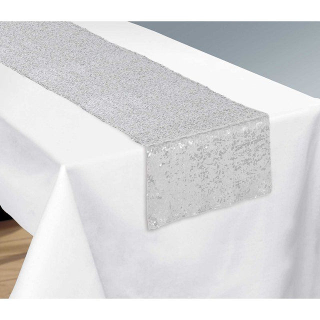 Silver sequin table runner measuring 33cm x 1.82m, perfect for adding glamour to any dining occasion.