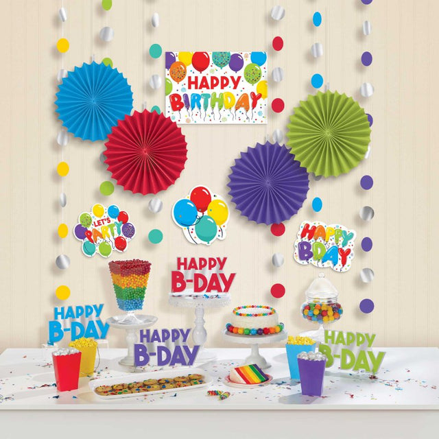 Colorful birthday decoration kit with strings, centerpieces, fans, and cutouts for vibrant party celebrations.