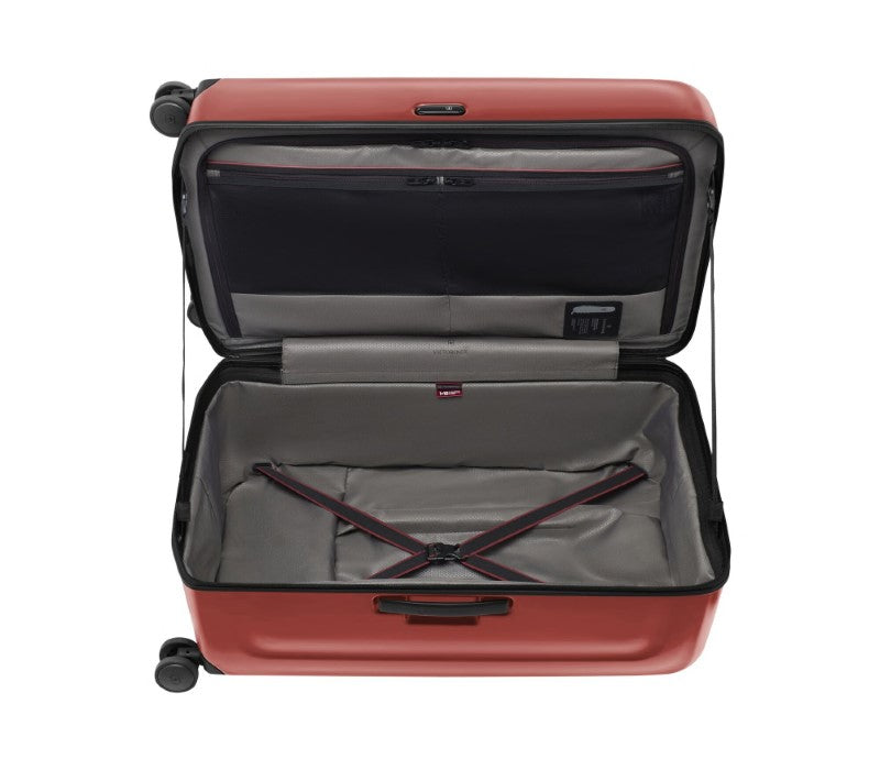 Large red Victorinox Spectra 3.0 suitcase with dual-caster wheels, 99L capacity, and integrated packing cubes for organized travel.