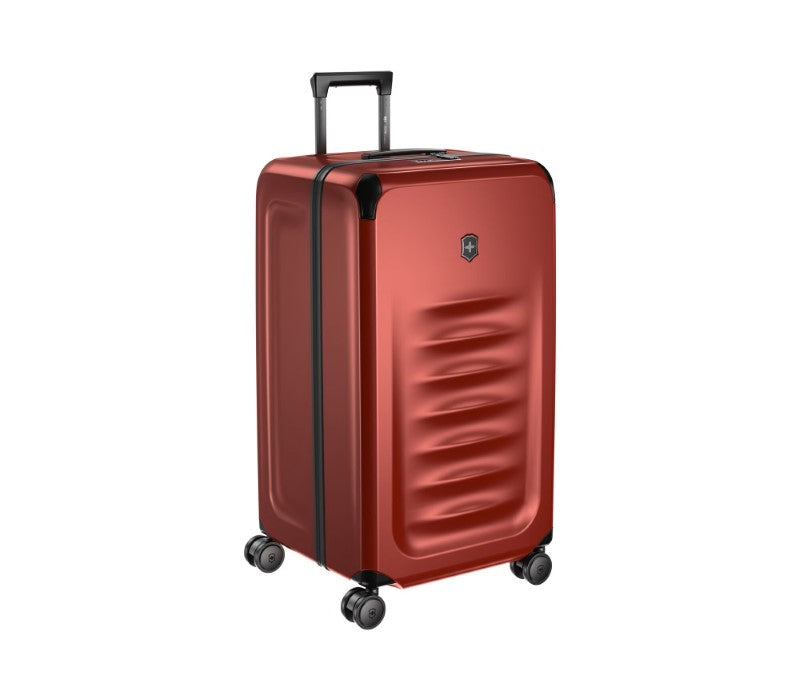 Red Victorinox Spectra 3.0 Trunk Large suitcase, made from recycled polycarbonate, featuring 99L capacity and dual-caster wheels.