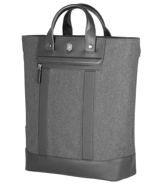 Versatile grey and black tote/backpack with padded laptop compartment and water-resistant zippers for modern professionals.