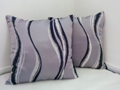 Set of 2 luxurious silver wave cushion covers, 42cm x 42cm, crafted from thick poly cotton for style and comfort.