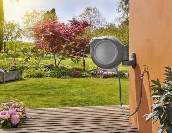 Gardena Roll Up Retractable Hose Reel with 30m hose features automatic retraction, 180° swivel, and tangle-free design for easy watering.