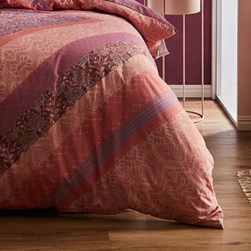 Bohemian-inspired Logan & Mason Navajo Rose Quilt set with overscaled diamond patterns in a rich berry color for super king beds.