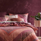 Logan & Mason Navajo Rose quilt set features a diamond pattern in berry tones, perfect for stylish super king beds.